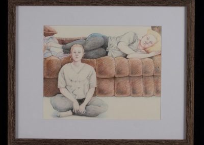 A self-portrait with two images of the same girl, one laying on a couch and one sitting.