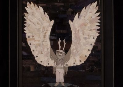 A paper collage of a person with wings and antlers on black paper.