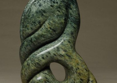 A green and blue soapstone sculpture.