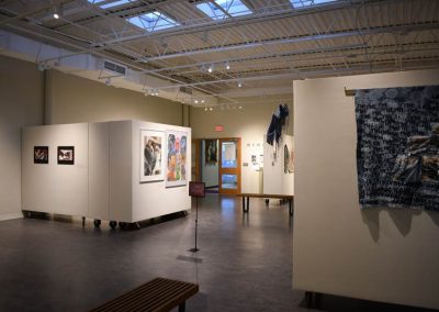 A back view of the memoirs gallery showing multimedia artwork.